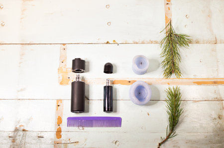 perfume spray bottles on a minimalistic background, with various decorative elementsの写真素材