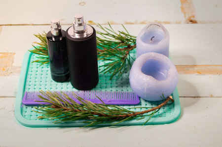 perfume spray bottles on a minimalistic background, with various decorative elementsの写真素材