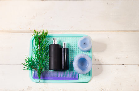 perfume spray bottles on a minimalistic background, with various decorative elementsの写真素材