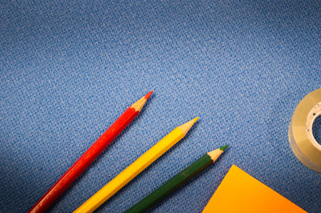 stationery on a blue background, various multi-colored elements