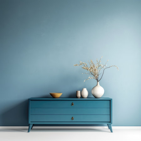 Interior design of living room with blue dresser over white wall. Home decor background with accessories. Wall with copy spaceの素材