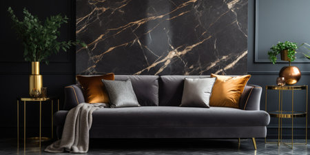 Black velvet sofa with patterned cushions near marble wall decorated with golden metal lines. Interior design of modern living roomの素材