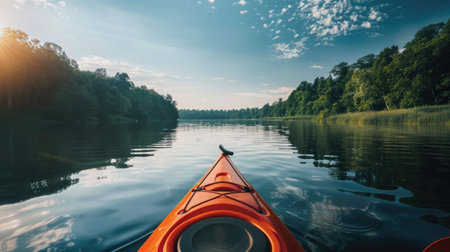 Kayak on the lake in the forest at sunset. Beautiful summer landscape.の素材