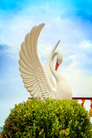 White swan statue in templeの写真素材