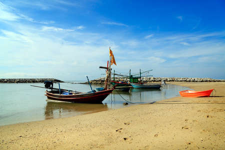 Beautiful beach with fishing boat at Prachuap Khiri Khan Province, Thailandの写真素材