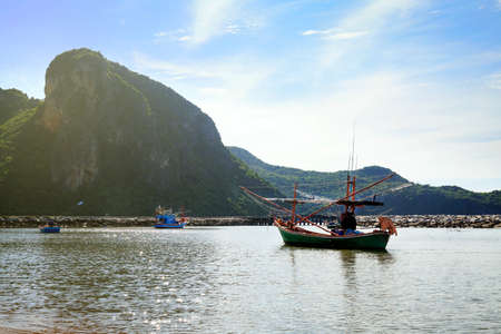 Beautiful beach with fishing boat at Prachuap Khiri Khan Province, Thailandの写真素材