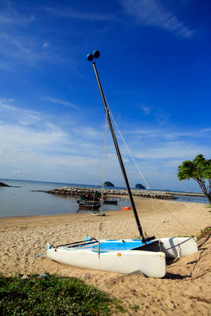 Boat on the sand at Prachuap Khiri Khan Province, Thailandの写真素材