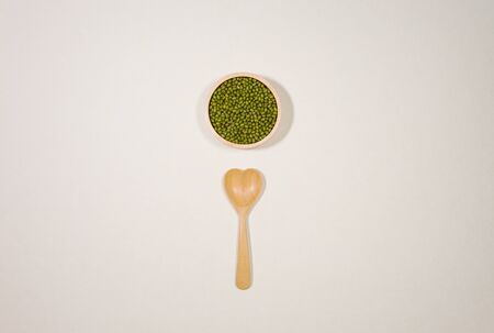 minimal style wooden bowl  Green beans with hart wooden spoonの写真素材