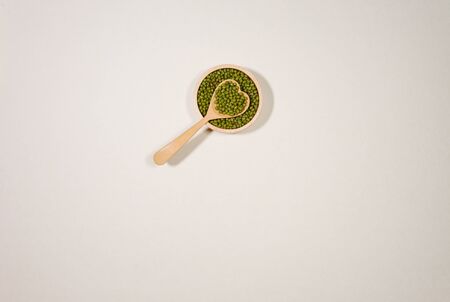 minimal style wooden bowl  Green beans with hart wooden spoonの写真素材