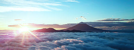 The sea of clouds surrounding Mt. Fuji and the sunrise from the horizon