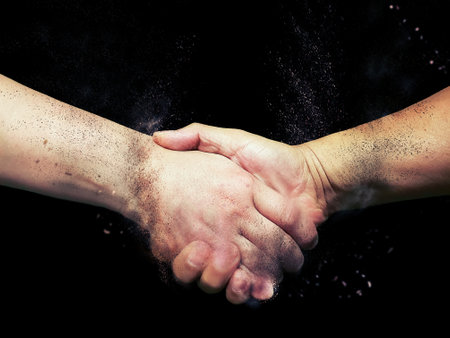 3d illustration combining handshake gesture with smoke effectの写真素材