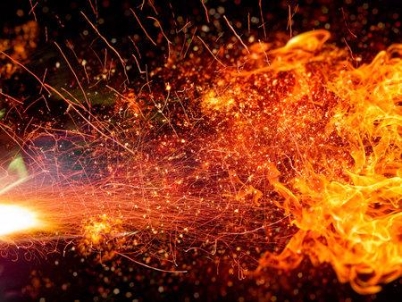 Black background with fire flames exploding in energy conceptの写真素材