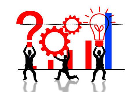 Businessmen in front of a business graph with question mark and lightbulbの写真素材
