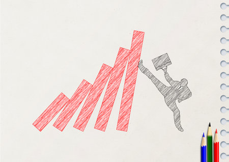 Silhouette illustration of a businessman supporting a falling red chart graph with his foot in business conceptの写真素材