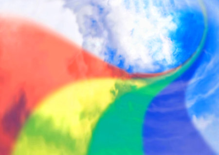 abstract rainbow colors background with blue sky and white clouds in the middleの写真素材