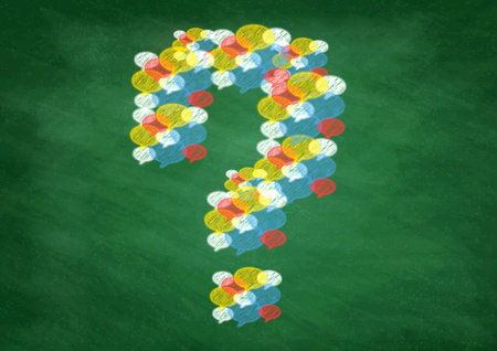 A chalk-style question mark illustration drawn in a colorful speech bubble (on a blackboard background)の写真素材