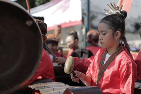 Indonesian Girl Traditional Java Music Instrument Culture Carnivalのeditorial素材