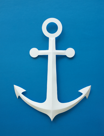 Symbol made of paper with blue background.の写真素材