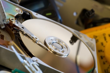 Pile of Old computer parts and hard disksの写真素材