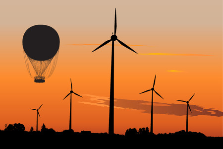 Vector silhouette of wind turbines and Air Balloon against sunset skyのイラスト素材