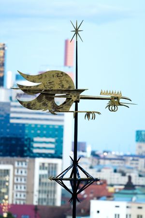 Golden weathercock in old city of Tallinn, Estonia 