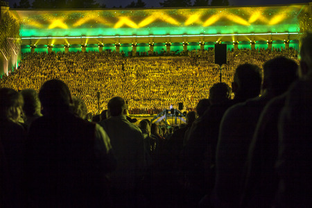 RIGA, LATVIA - July 7, 2013: The Latvian National Song and Dance Festival Grand Finale concert \\\"Ligo!\\\". View on  mass choir from spectator seats.のeditorial素材