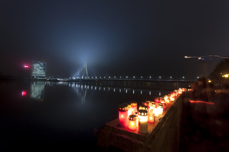 Candles at the embankment of river Daugava in Riga, Latvia. People light candles to commemorate victory over Russian German militia. It was keypoint in birth of Latvia as independent nation.の写真素材