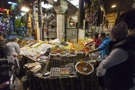 ISTANBUL - MARCH 19: People shopping in the Egyptian Bazaar also known as Spice Bazaar. This is one of the largest covered markets  in city and is the center for spice trade.のeditorial素材
