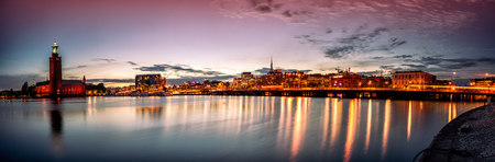 Stockholm sunset skyline with City Hall as seen from Riddarholmen. Panoramic montage from 13 imagesの写真素材