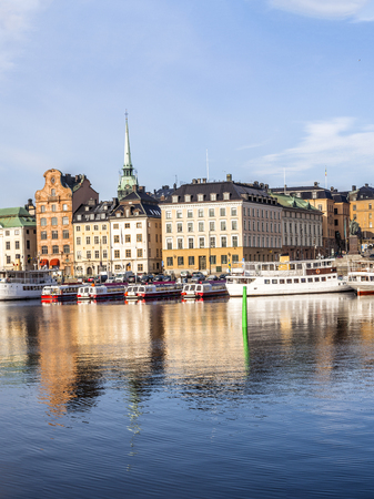 Stockholm daylight skyline panorama of Gamla Stan with white shipsの写真素材