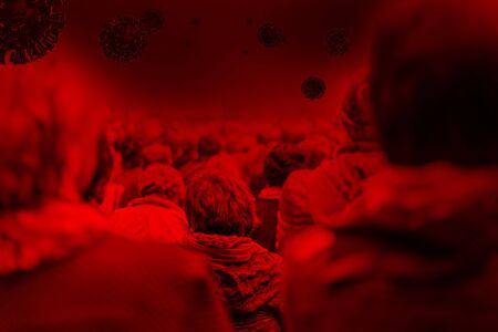 Silhouettes of Covid-19 viruses above Large crowd of unrecognisable people in cityの写真素材