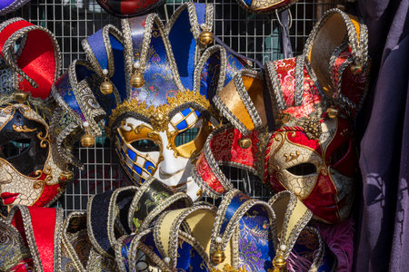 A close-up view of several ornate Venetian carnival masksの写真素材