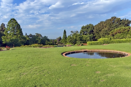Beautiful landscape with small circle pond at Emmarentia park in Johannesburgの写真素材