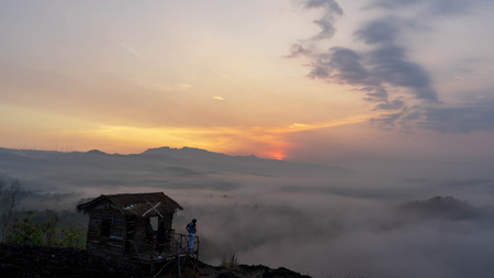 sunrise views in the summer that emerge from the hills in a villageの写真素材