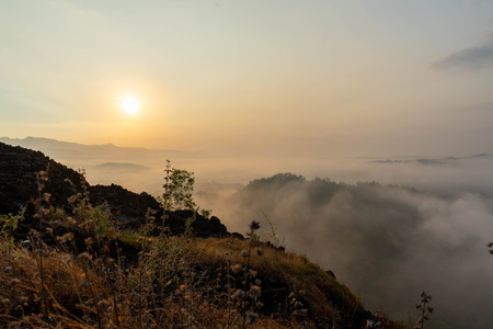 sunrise views in the summer that emerge from the hills in a villageの写真素材