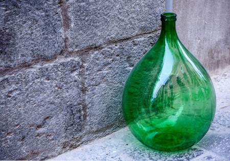Wine bottle on the sidewalkの写真素材