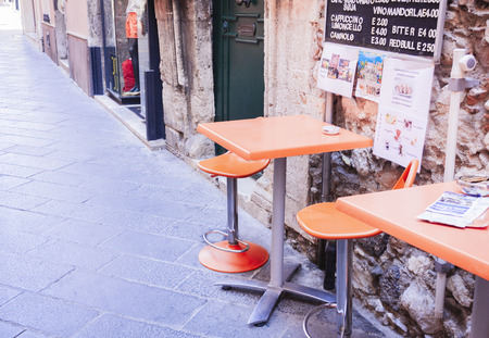 Taormina, Sicily: tables with chairs on the street cafeの写真素材