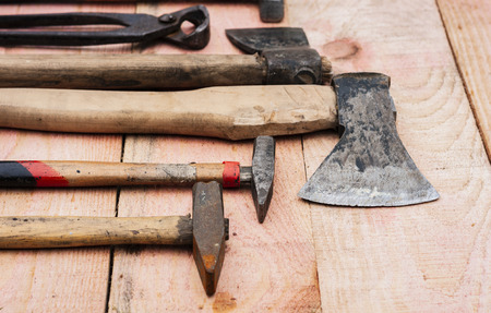 vintage hand construction tools, wooden background