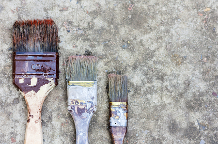 Paintbrushes on the sidewalk, well usedの写真素材