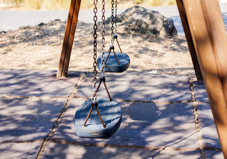 Empty children swing in Park Gioeni, Catania, Sicily, Italyの写真素材