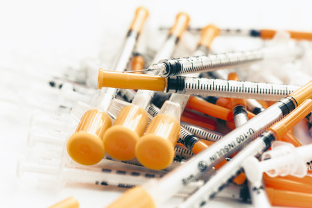 Pile of medical syringes for insulin for diabetesの写真素材