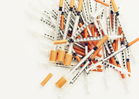 Pile of medical syringes for insulin for diabetesの写真素材
