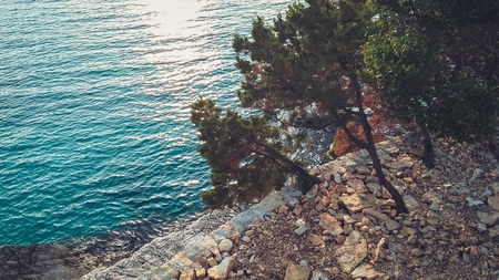 Rocky shore next to Ksamil, Saranda, Albanian Riviera, beautiful seascape, sunsetの写真素材
