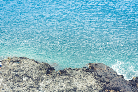 Rocky sea shore of Acitrezza next to Cyclops islands, Catania, Sicily, Italyの写真素材