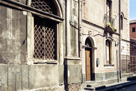 Beautiful cityscape of Italy, historical street of Catania, Sicily, facade of old buildingsの写真素材