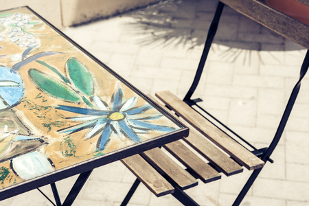 Table with chair on the street cafÃ© in Syracuse (Siracusa), Sicily, Italyの写真素材