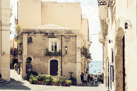 Syracuse, Sicily, Italy â august 12, 2018: people walk on the historical street of the Ortygia (Ortigia) islandのeditorial素材