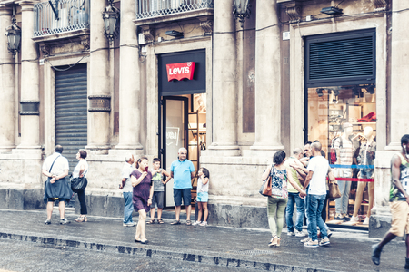 Catania, Sicily â august 15, 2018: people walk on historical street of the city, travel to Italyのeditorial素材
