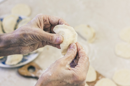 Preparing, cooking, making homemade dumplings with cabbageの写真素材