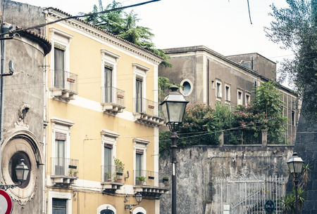 Typical street of Catania, facade of old buildingsの写真素材
